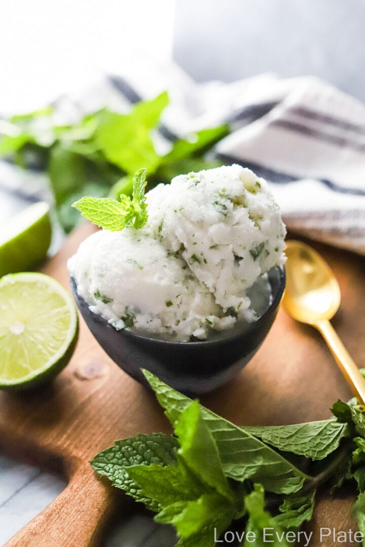 scoop of coconut lime sorbet with mint leaves on top