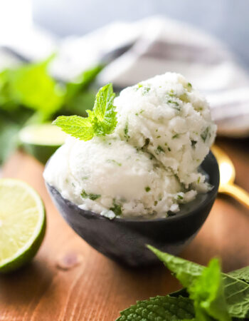 two scoops of coconut lime sorbet with mint leaves on top