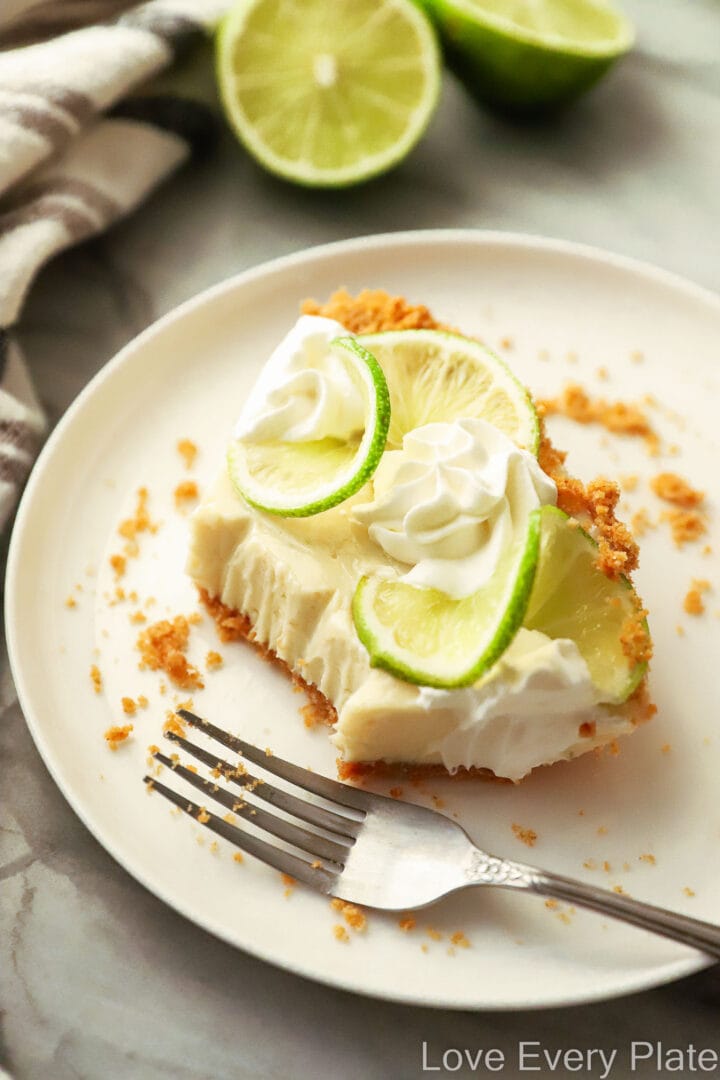 slice of key lime pie with a bite take out