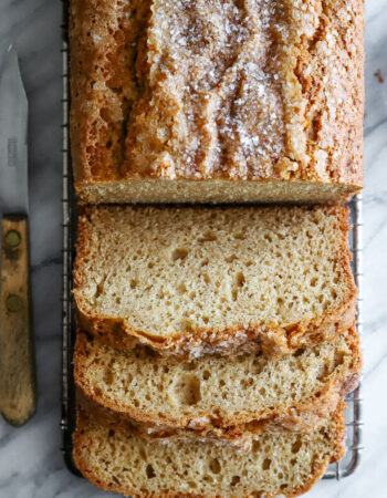 sliced loaf of cinnamon bread with knife off to the side