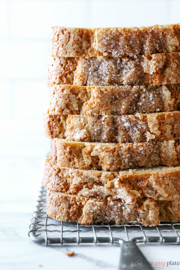 stacked slices of cinnamon bread with crunchy sugar topping