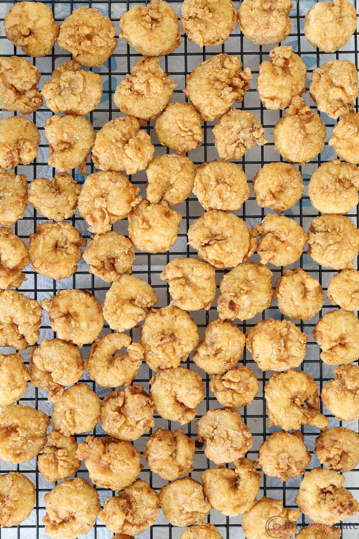 cooling rack full of fried shrimp