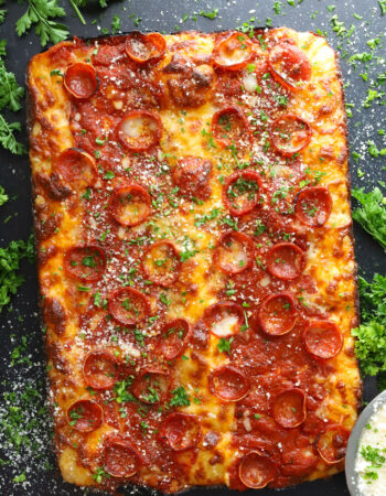 top view of a detroit style pizza with pepperoni and cheese