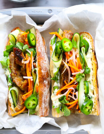 sandwich with pork, mayo, vegetables and herbs