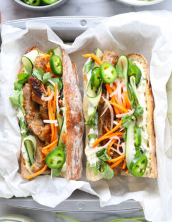 sandwich with pork, mayo, vegetables and herbs
