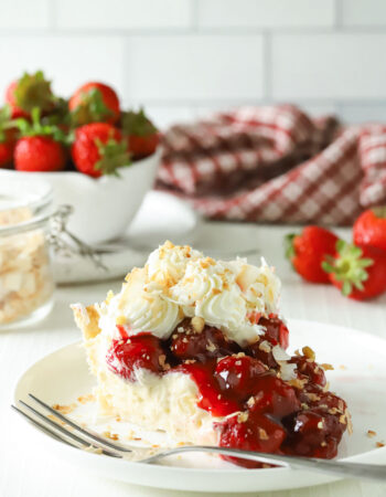 slice of strawberry pie with whipped cream and coconut