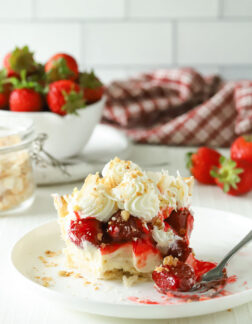 slice of strawberry pie with whipped cream and coconut