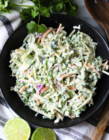 top view of a black bowl of cilantro lime coleslaw