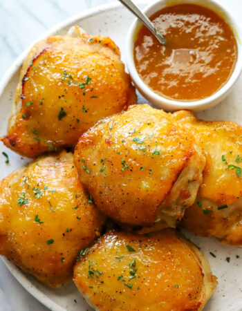 plate of peach glazed chicken thighs