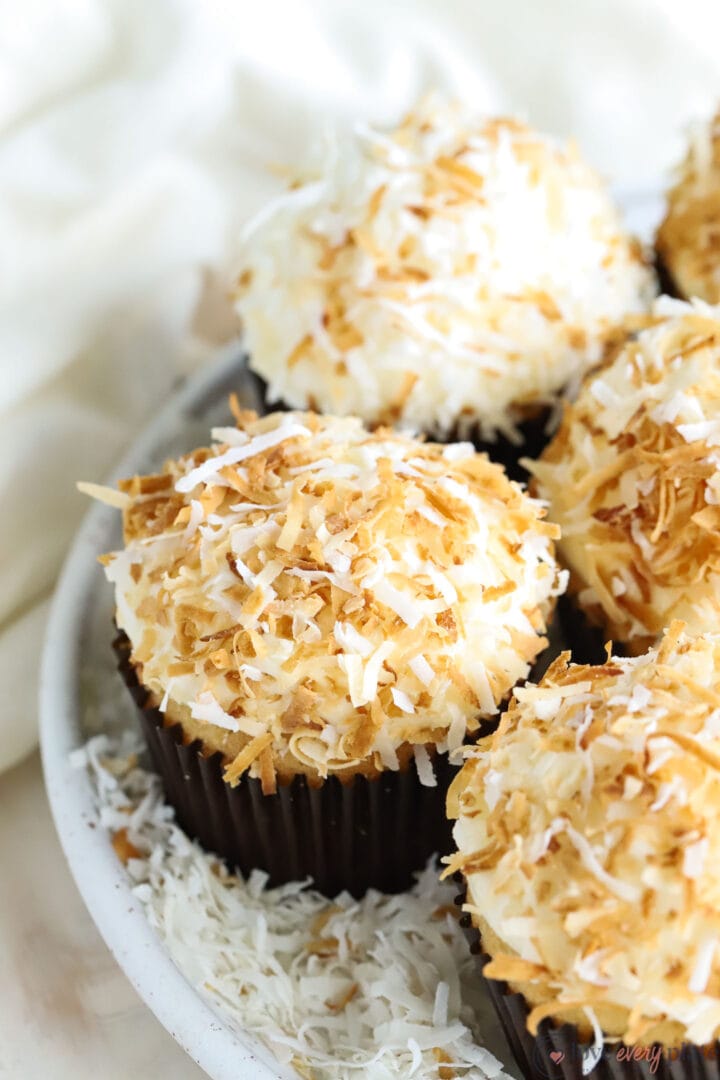 coconut cupcake with toasted flaked coconut on top