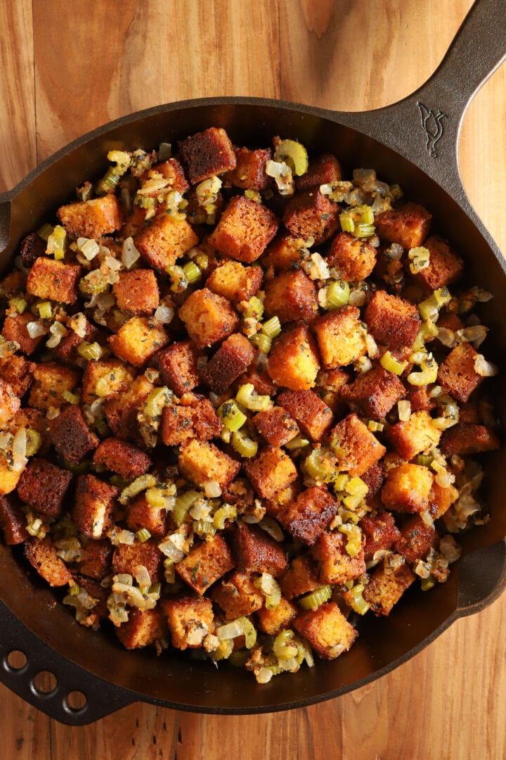 top view of a cast iron skillet full of cornbread stuffing