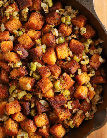 top view of a cast iron skillet full of cornbread stuffing