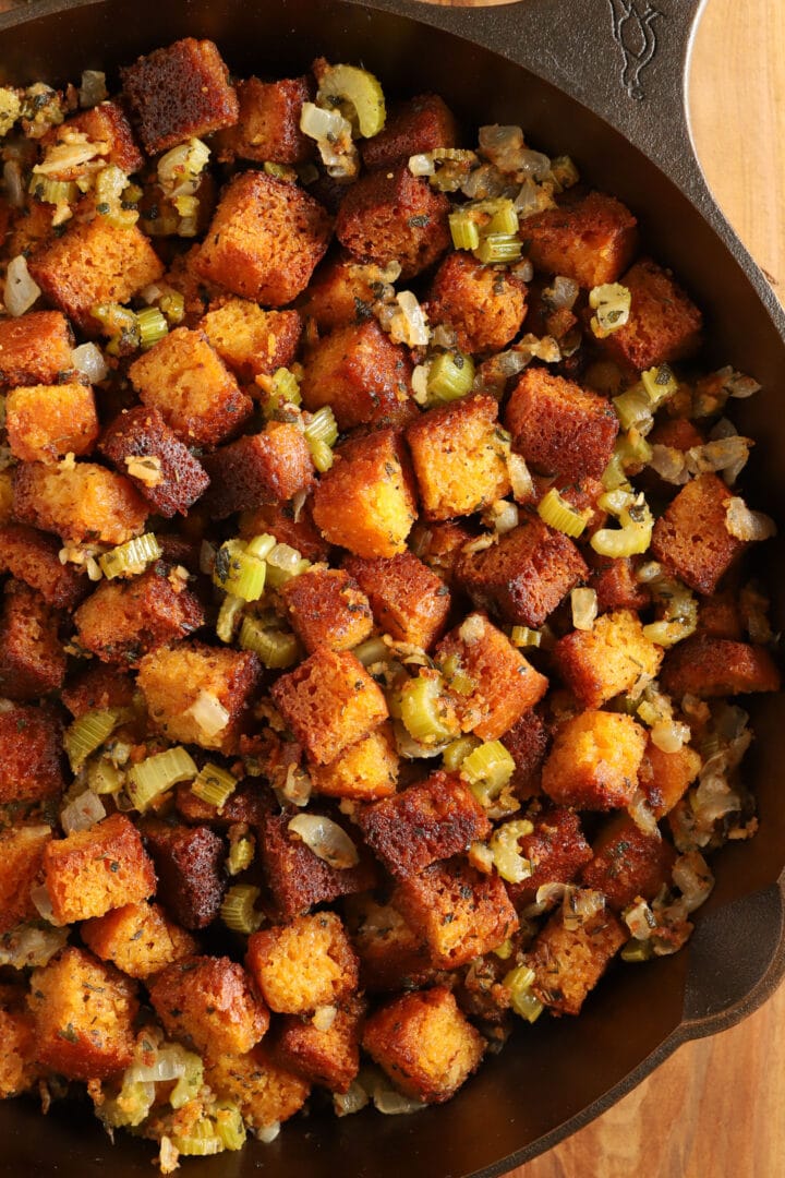 top view of a cast iron skillet full of cornbread stuffing