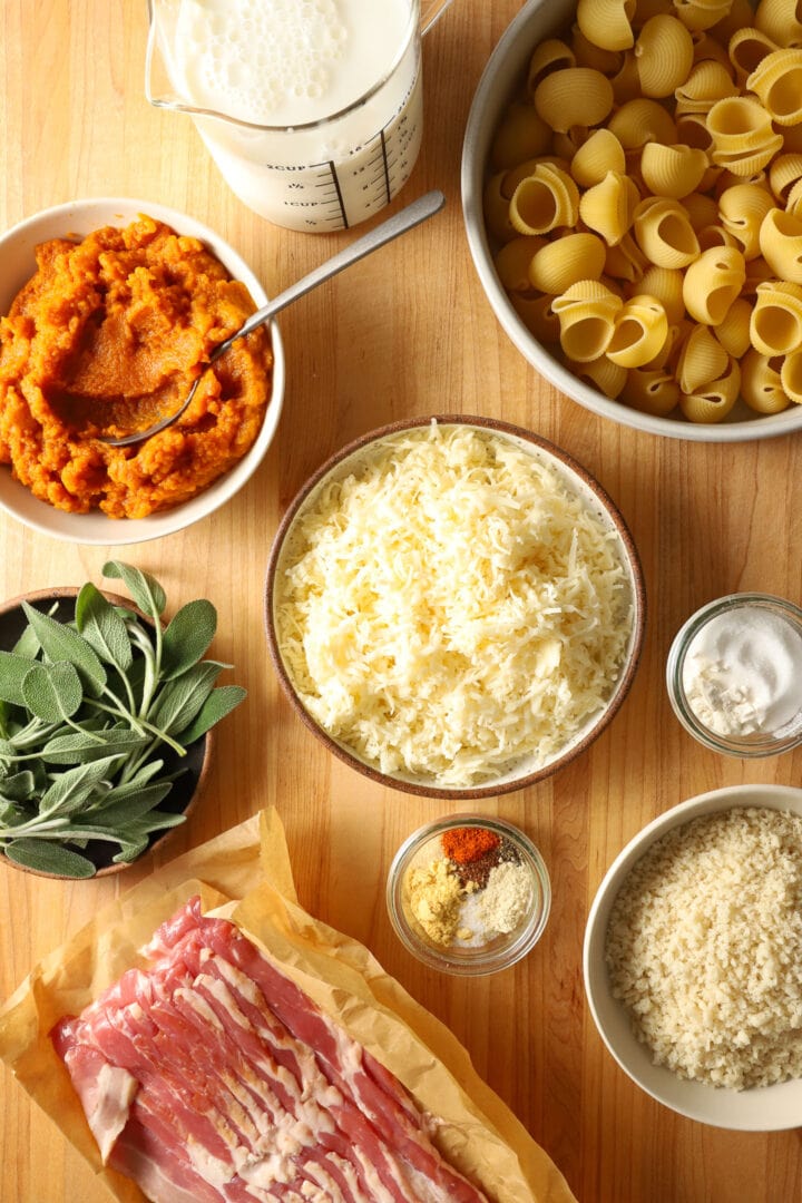 top view of a cutting board full of ingredients for pumpkin mac and cheese