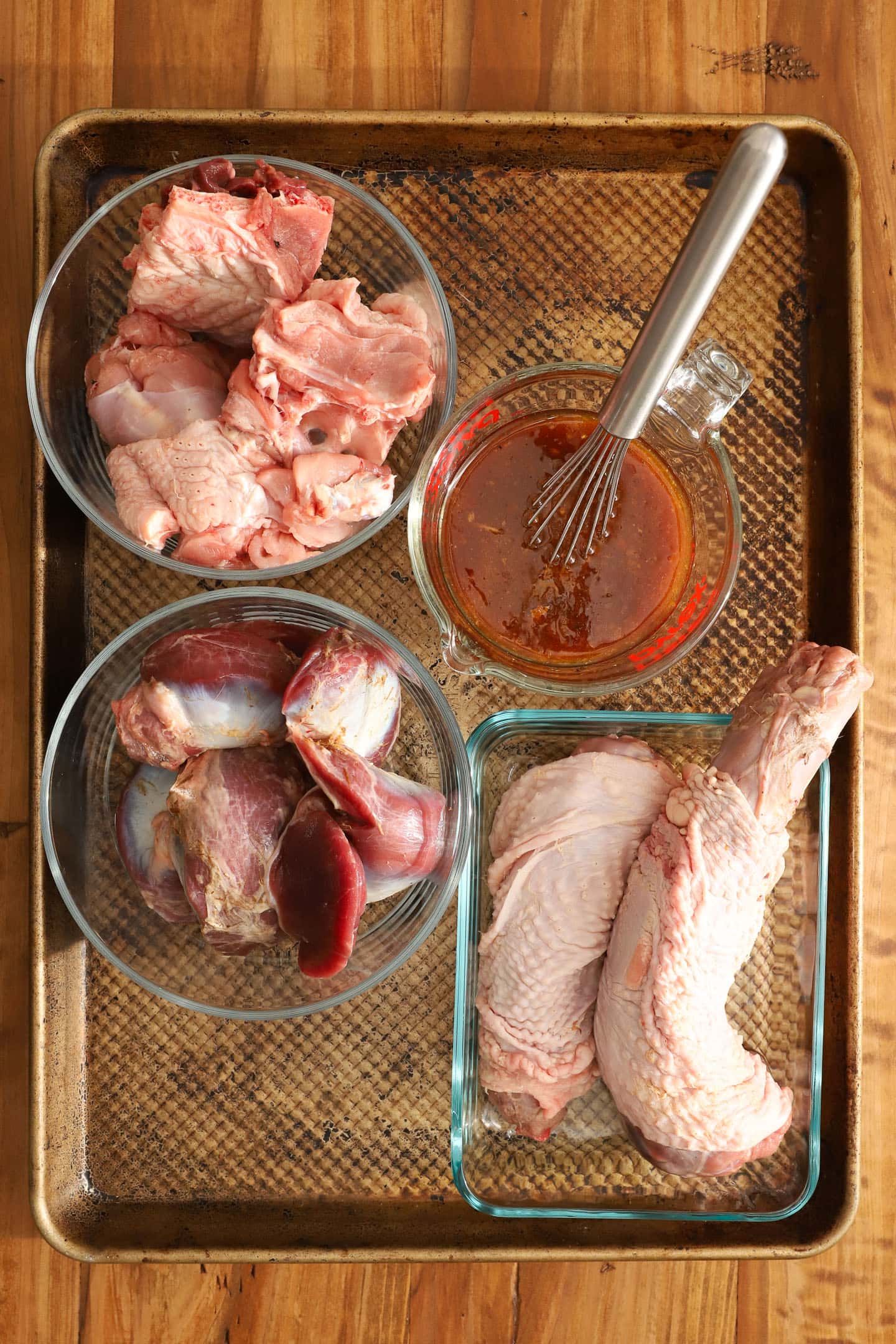 tray of turkey parts, including gizzards, necks and a chopped up backbone