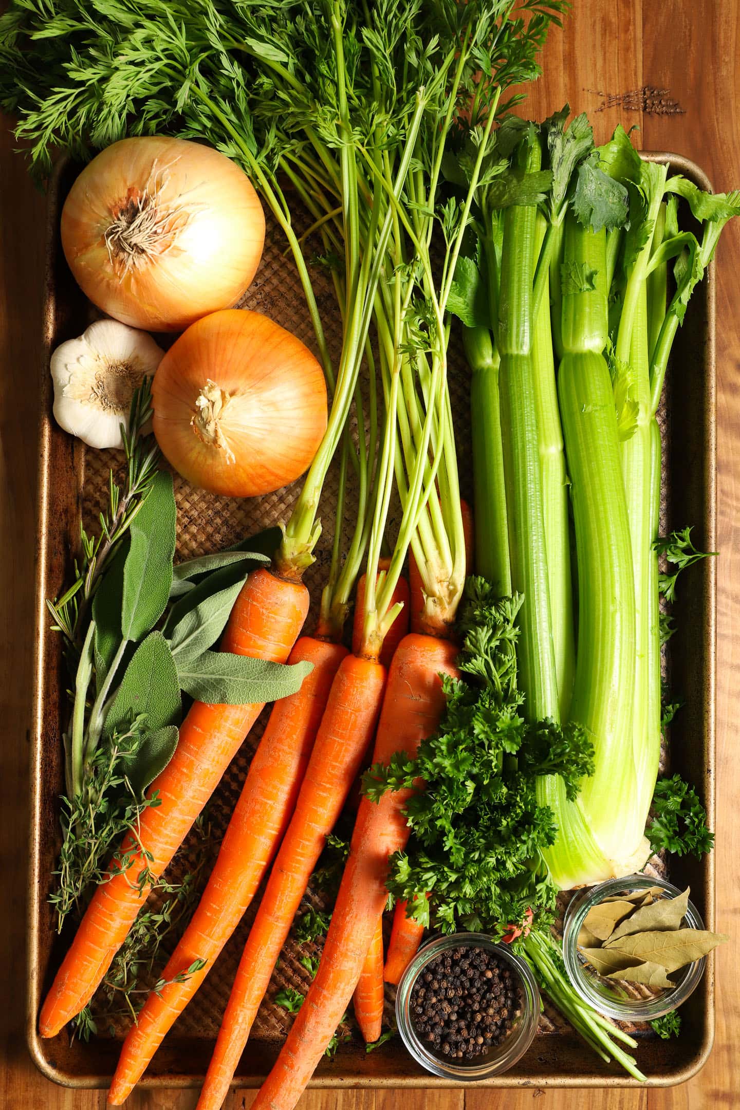 sheet pan full of fresh vegetables, herbs and spices for turkey stock