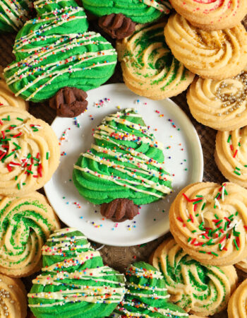 top shot of a christmas tree shaped cookie, surrounded by additional christmas cookies