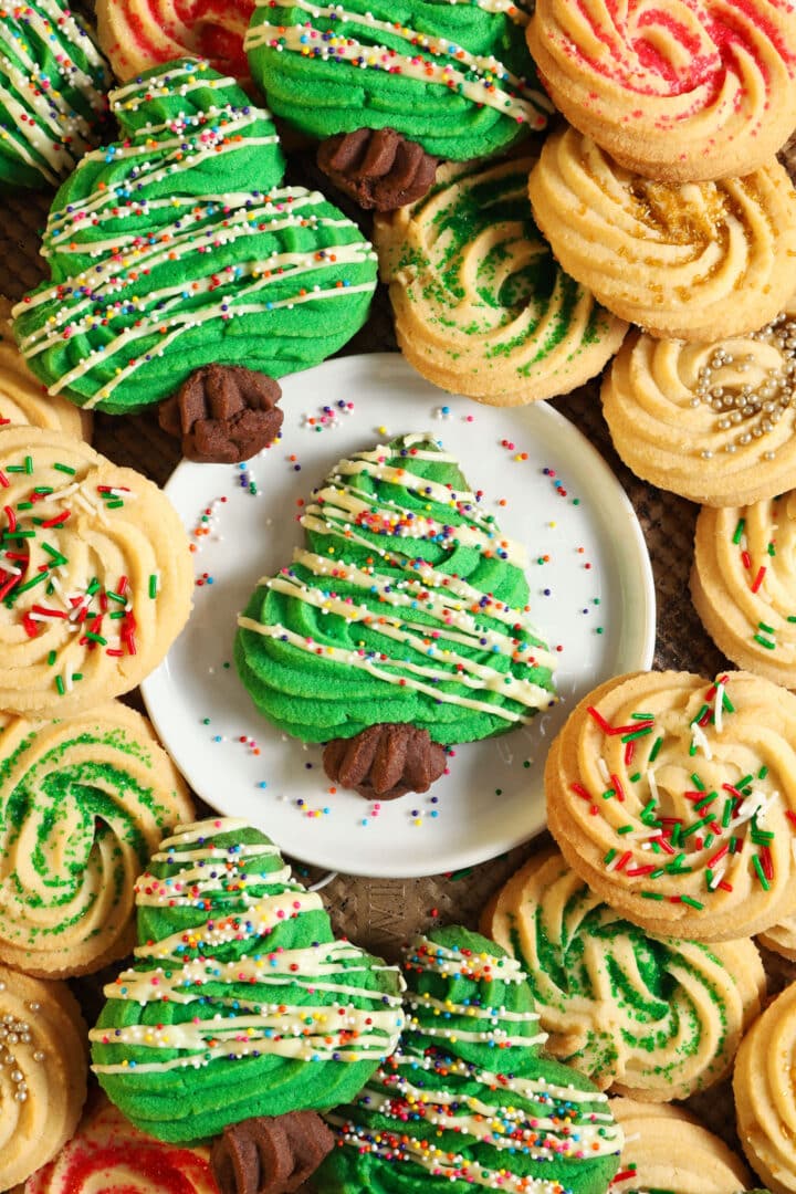 top shot of a christmas tree shaped cookie, surrounded by additional christmas cookies