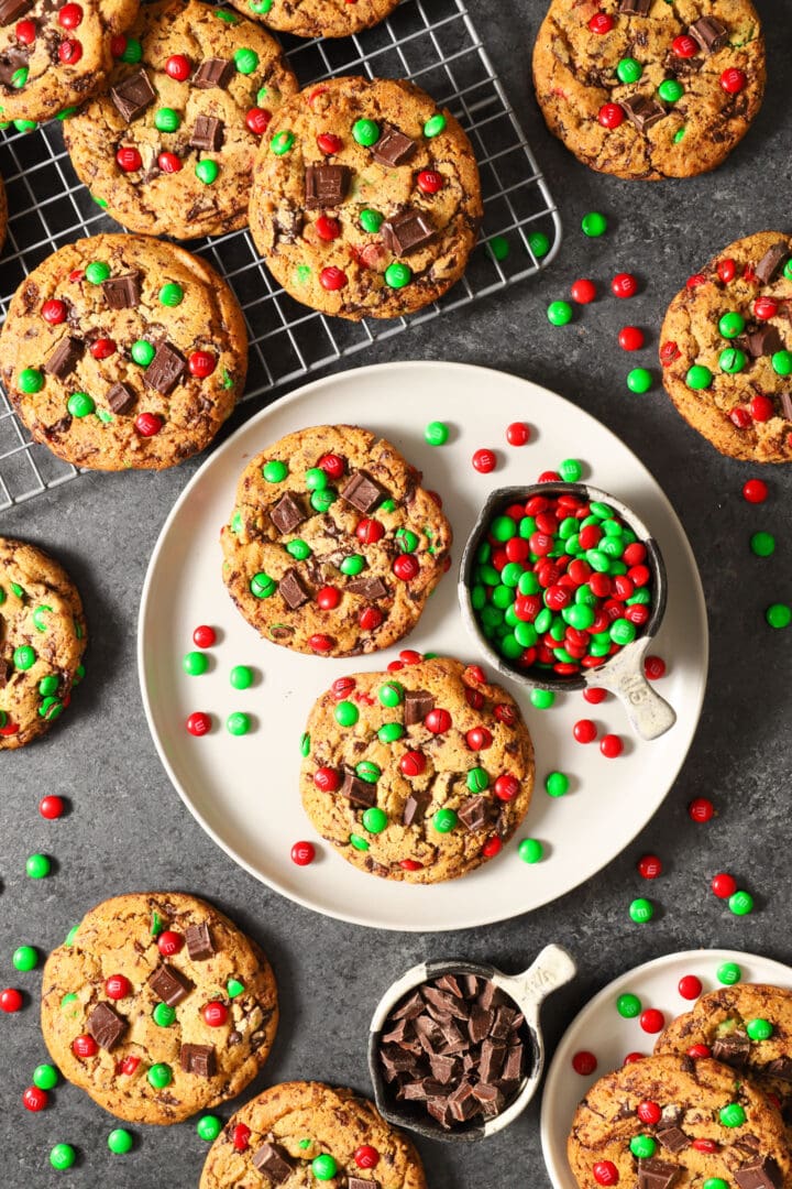 top view of several christmas chocolate chip cookies with red and green candies