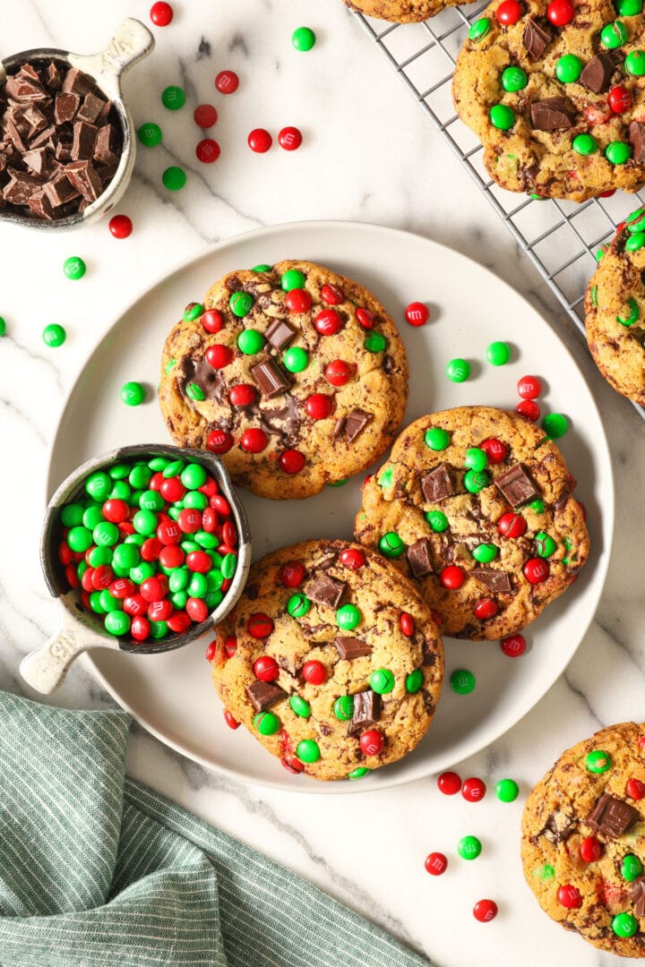 top view of a white plate with three christmas chocolate chip cookies