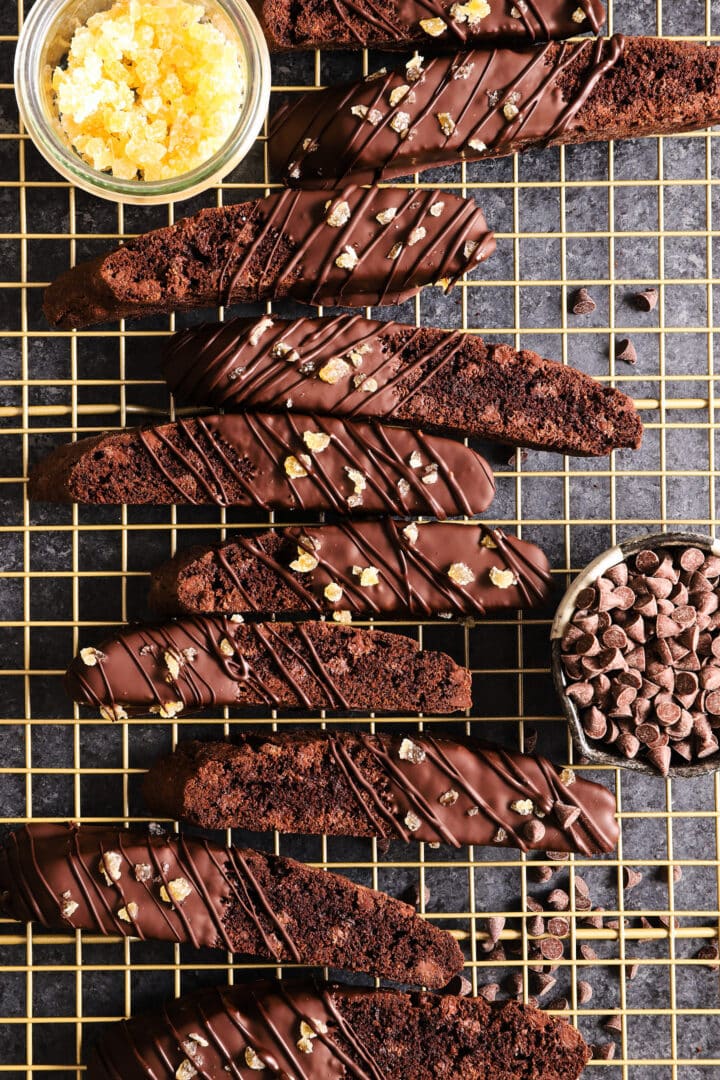 top shot of a gold cooling rack filled with chocolate biscotti.