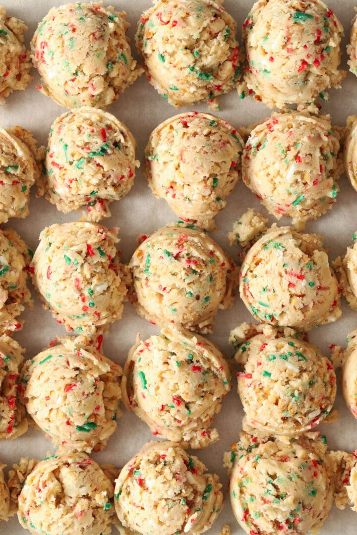 sheet pan full of christmas wedding cookie dough balls.