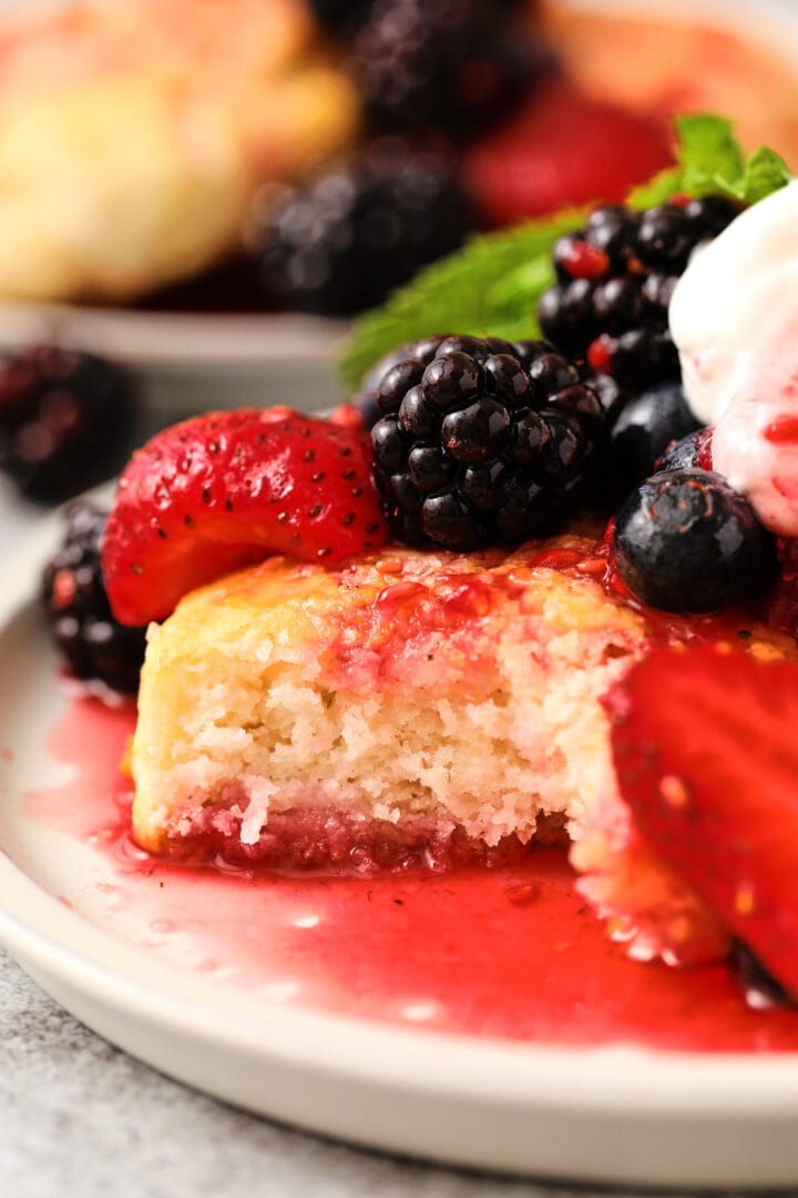 small gray plate with biscuit shortcake and blackberries on top.