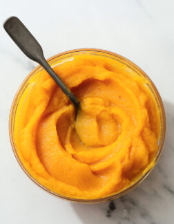 small glass bowl of fresh pumpkin puree.