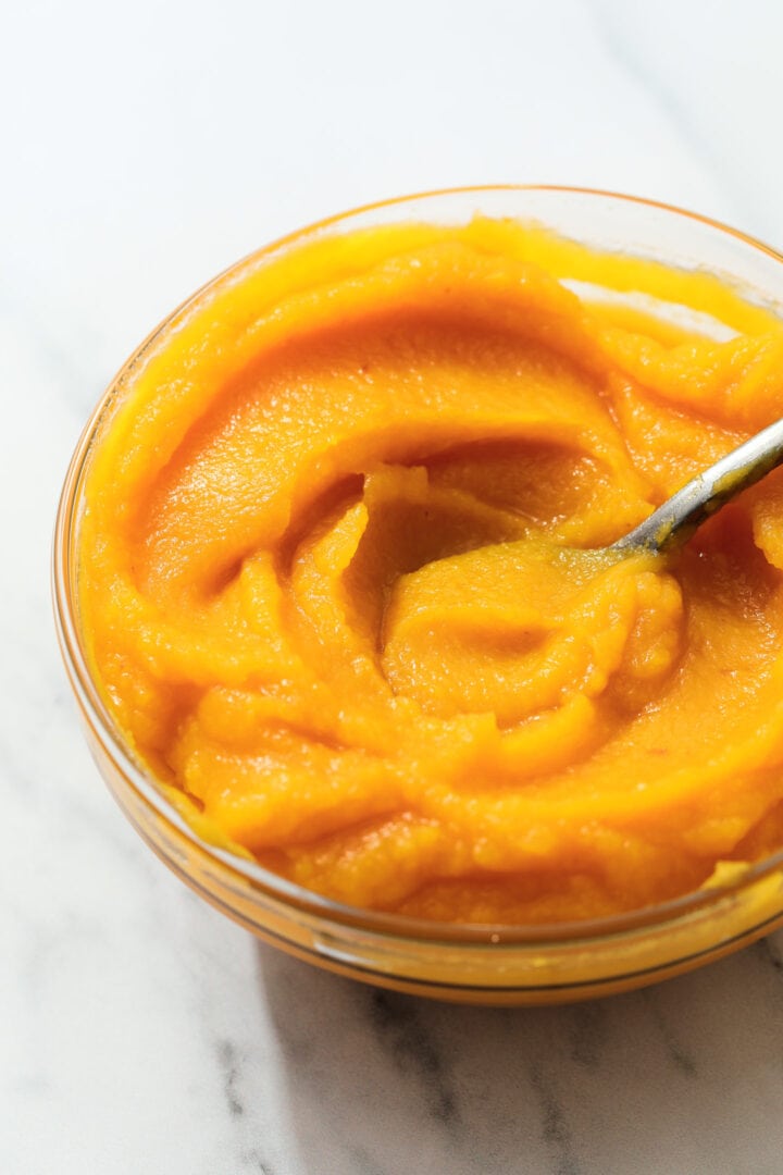 small glass bowl of fresh pumpkin puree.