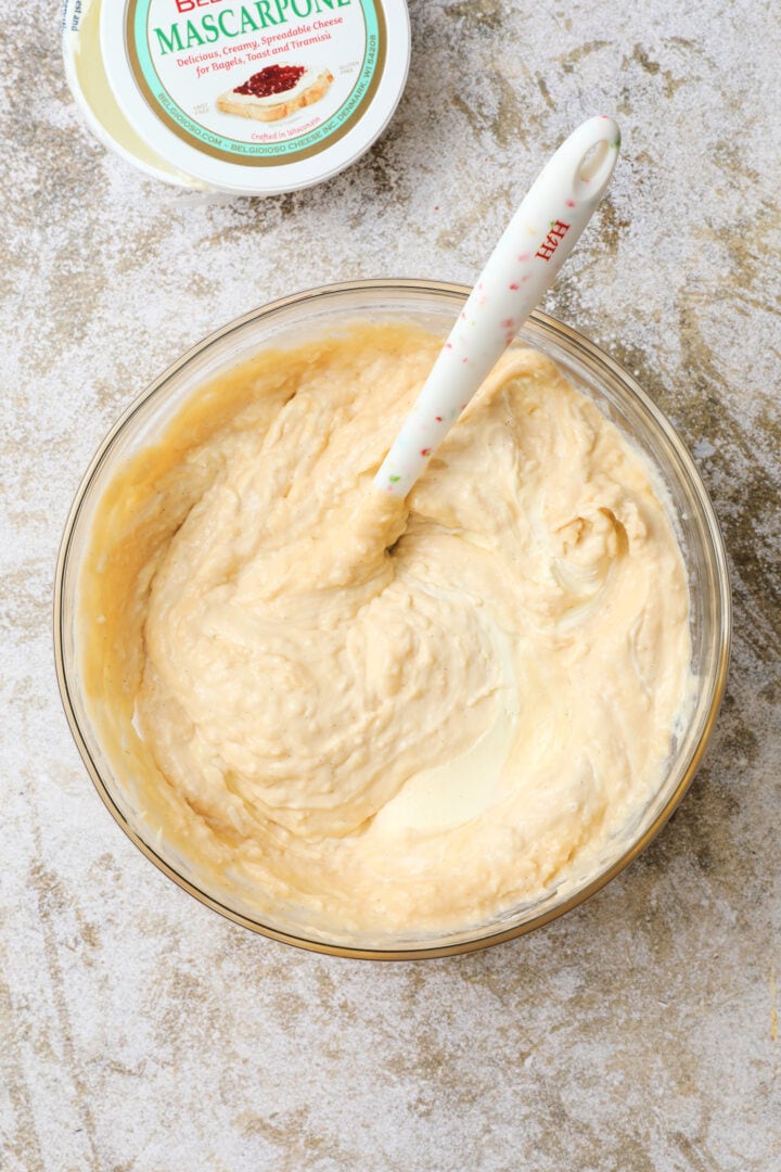 large bowl of completed coconut cream, ready to use in the tiramisu.