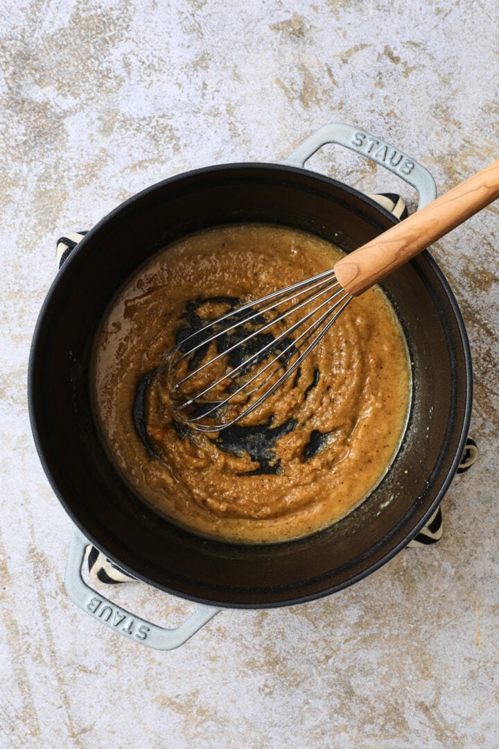 Flour and spices are added to the melted butter to create a roux.