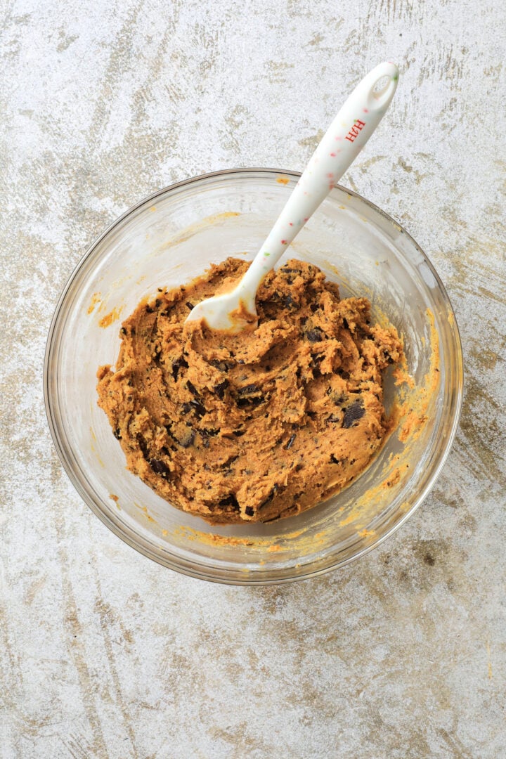 a large bowl of pumpkin chocolate chip cookie dough.